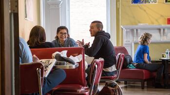 students sitting outside of carr haus cafe