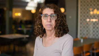 photo of a woman in a light tan sweater
