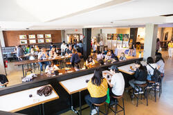 students eating in the Met