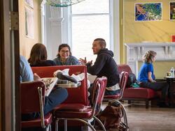 students sitting outside of carr haus cafe