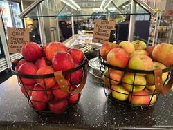 two baskets of apples sourced from local farms