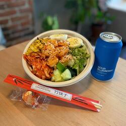 noodle bowl from jolly roger with blueberry soda and chopsticks