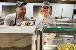 dining staff in the kitchen smiling